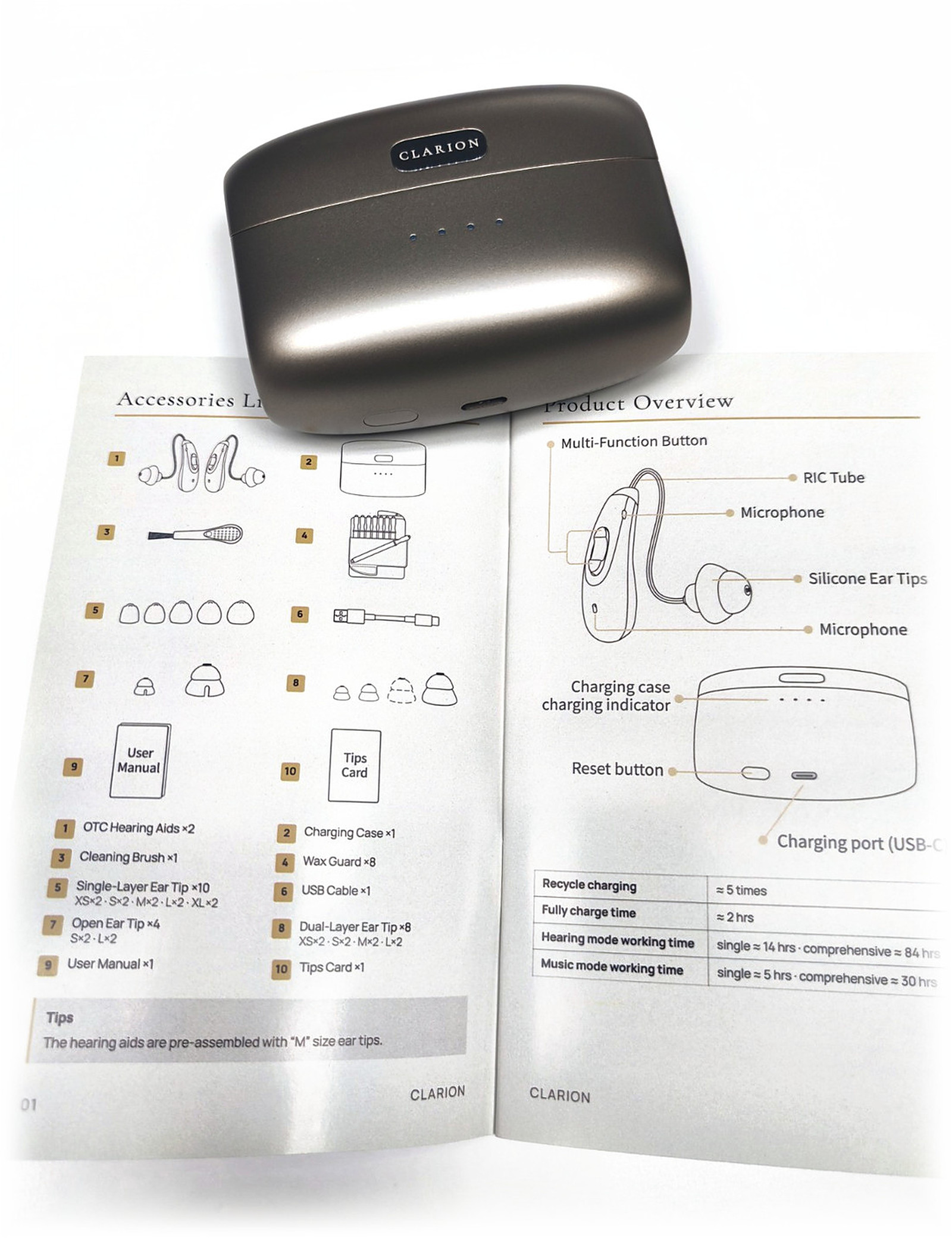 The charging case resting on the open printed user manual, on white.